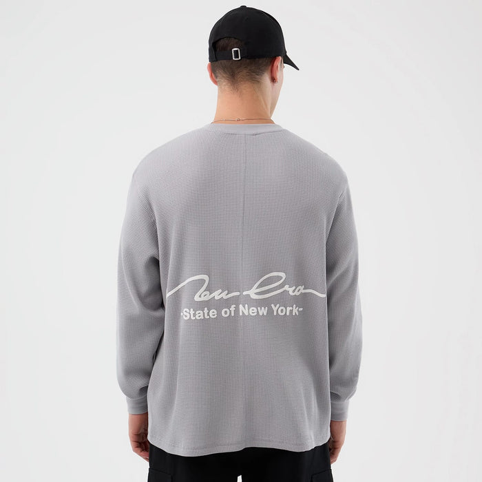 The Male model is wearing New Era Basic Grey Long Sleeve T-Shirt 2