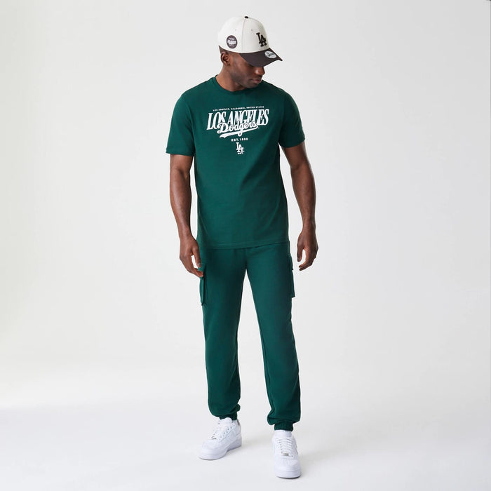 The Male model is wearing New Era Core Cargo Dark Green Joggers 8
