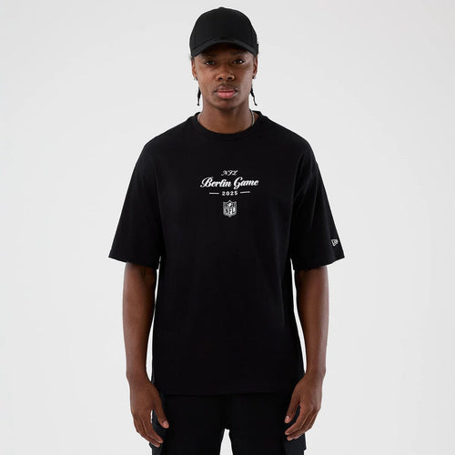 The Male model is wearing Berlin NFL International Series Games Black Oversized T-Shirt 1