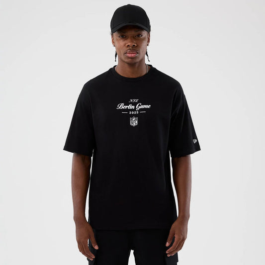 The Male model is wearing Berlin NFL International Series Games Black Oversized T-Shirt 1