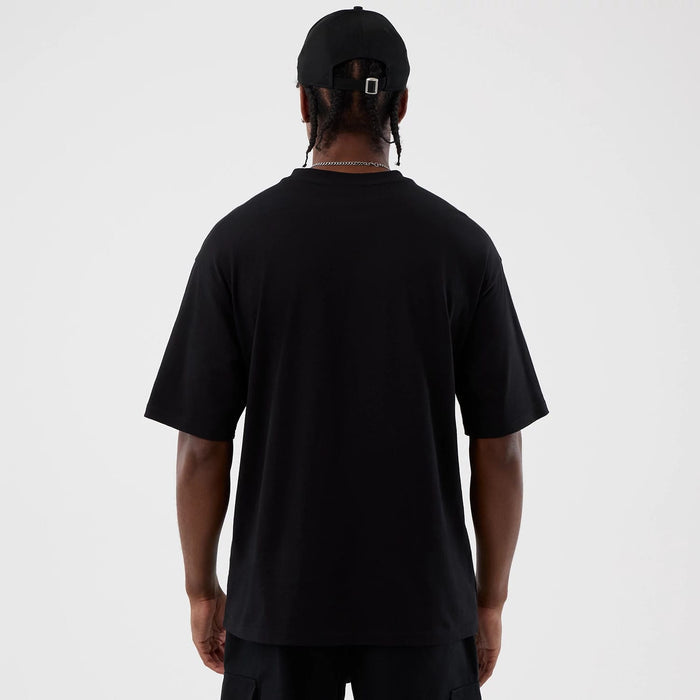 The Male model is wearing Berlin NFL International Series Games Black Oversized T-Shirt 2
