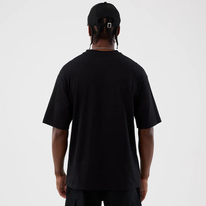 The Male model is wearing Berlin NFL International Series Games Black Oversized T-Shirt 2