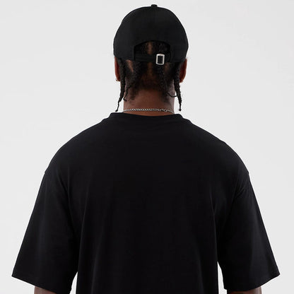 The Male model is wearing Berlin NFL International Series Games Black Oversized T-Shirt 7