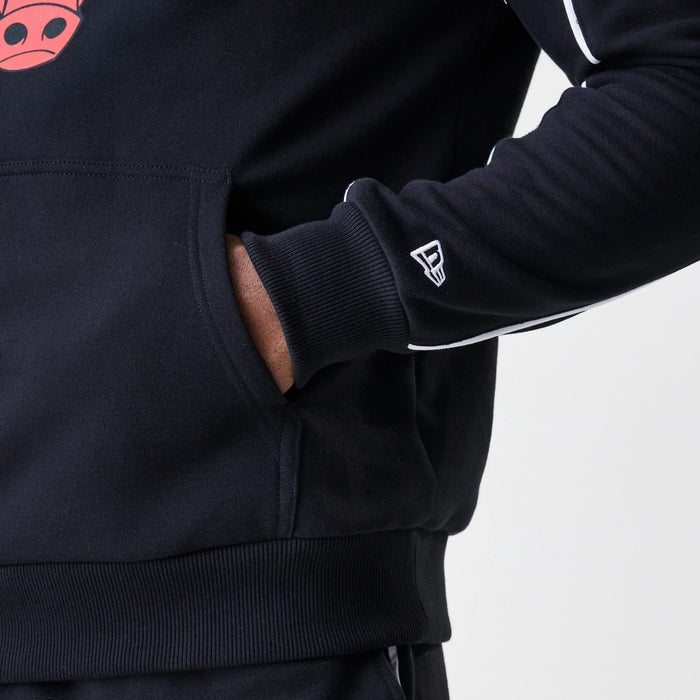 The Male model is wearing Chicago Bulls NBA Piping Black Oversized Pullover Hoodie 4