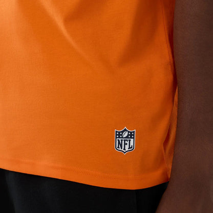 The Male model is wearing Denver Broncos NFL International Series Games 2025 Orange Oversized T-Shirt 5