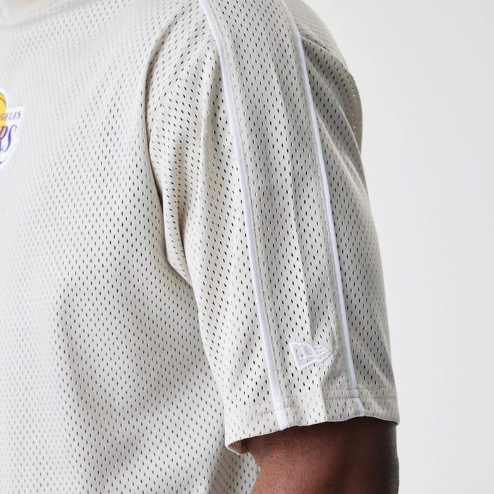 The Male model is wearing LA Lakers NBA Piping Light Beige Oversized Mesh T-Shirt 5