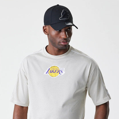 The Male model is wearing LA Lakers NBA Piping Light Beige Oversized Mesh T-Shirt 6