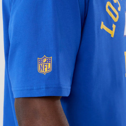 The Male model is wearing LA Rams NFL International Series Games 2025 Bright Blue Oversized T-Shirt 5
