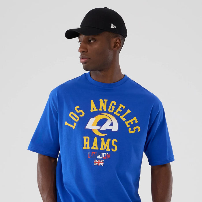 The Male model is wearing LA Rams NFL International Series Games 2025 Bright Blue Oversized T-Shirt 7