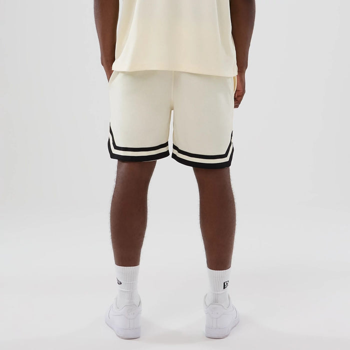 The model is wearing these NFL Historic Las Vegas Raiders shorts in cream. 2