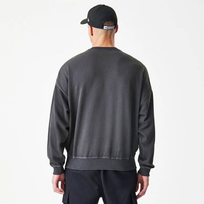 The Male model is wearing Las Vegas Raiders NFL Washed Boxy Dark Grey Oversized Crew Neck Sweater 2