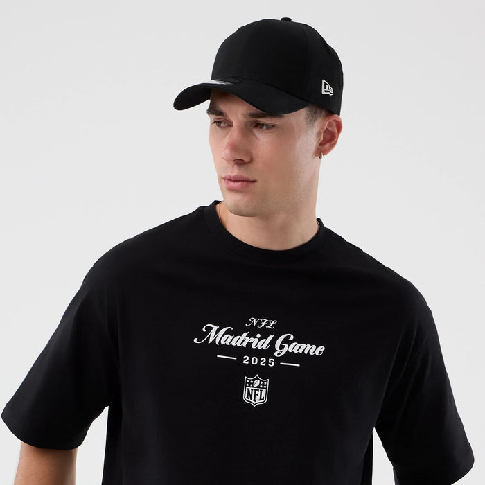 The Male model is wearing Madrid Game NFL International Series Games Black Oversized T-Shirt 6