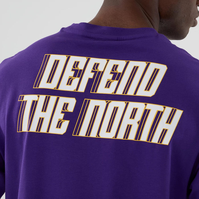 The Male model is wearing Minnesota Vikings NFL International Series Games 2025 Purple Oversized T-Shirt 6