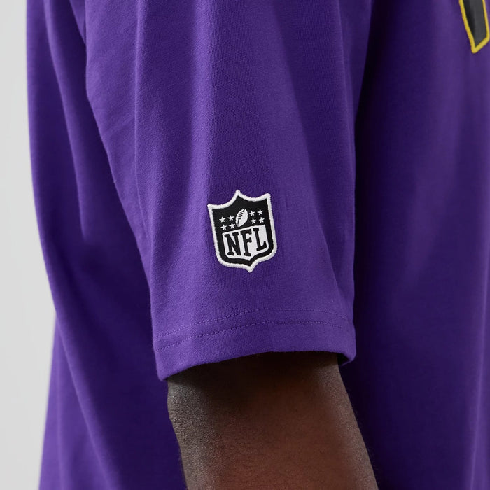 The Male model is wearing Minnesota Vikings NFL International Series Games 2025 Purple Premium T-Shirt 6