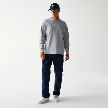 The Male model is wearing New Era 90s Vibe Grey Long Sleeve T-Shirt 3