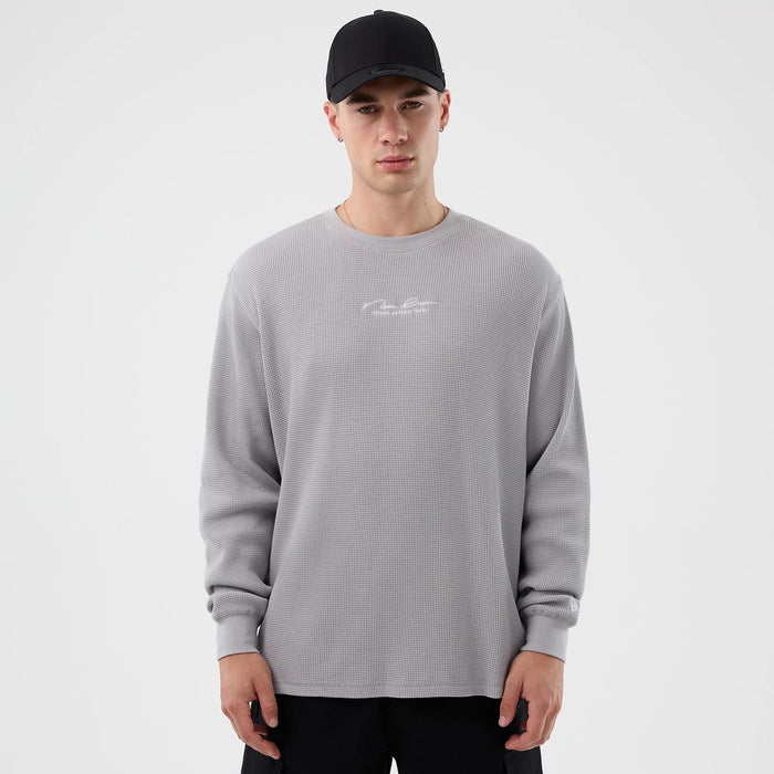 The Male model is wearing New Era Basic Grey Long Sleeve T-Shirt 1