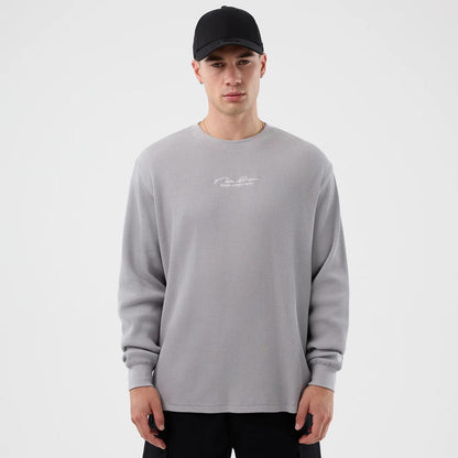 The Male model is wearing New Era Basic Grey Long Sleeve T-Shirt 1