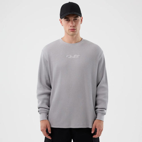 The Male model is wearing New Era Basic Grey Long Sleeve T-Shirt 1