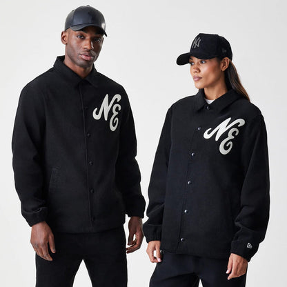 The Male model is wearing  New Era Cord Black Coaches Jacket 1