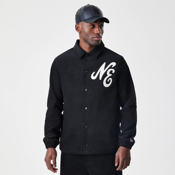 The Male model is wearing  New Era Cord Black Coaches Jacket 3