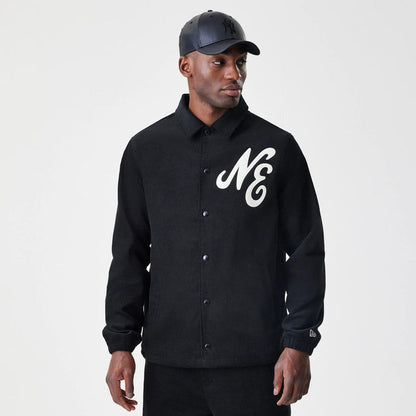 The Male model is wearing  New Era Cord Black Coaches Jacket 3