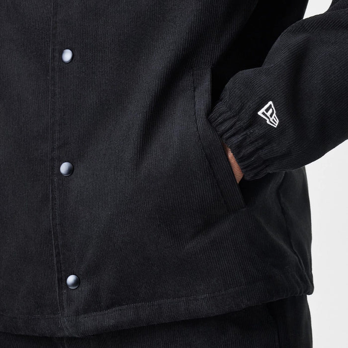 The Male model is wearing  New Era Cord Black Coaches Jacket 7