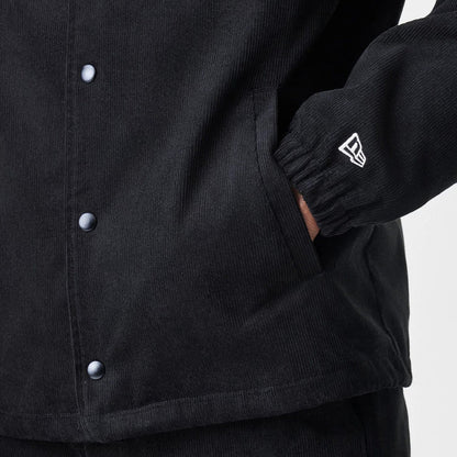 The Male model is wearing  New Era Cord Black Coaches Jacket 7