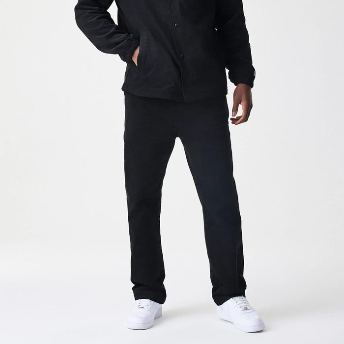 The Male model is wearing  New Era Cord Black Straight Leg Chinos 7