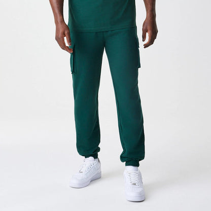 The Male model is wearing  New Era Core Cargo Dark Green Joggers 3