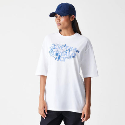 The Male model is wearing  New Era Floral White Oversized T-Shirt 4