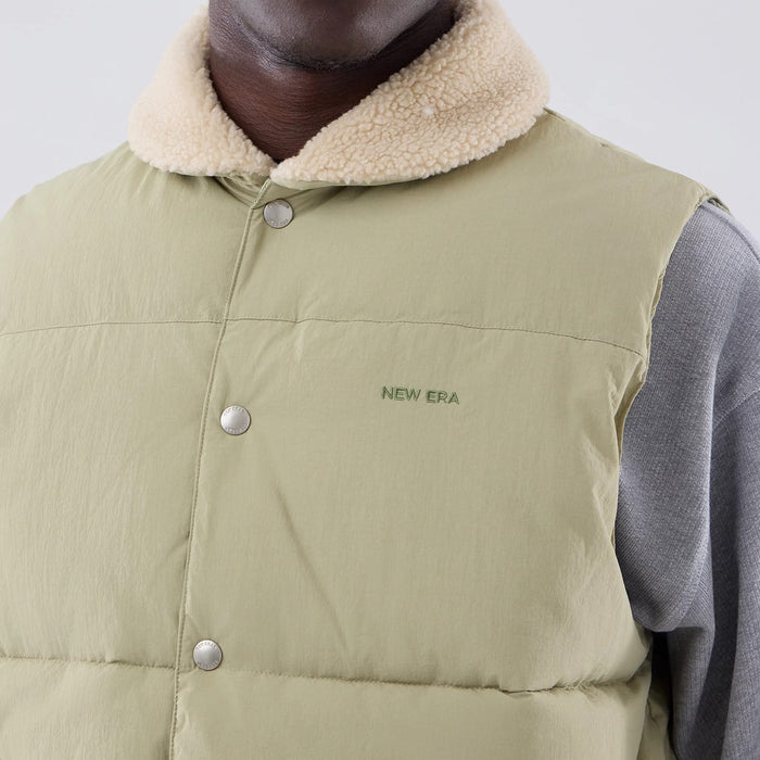 The Male model is wearing  New Era Organic Boa Neck Khaki Gilet 4