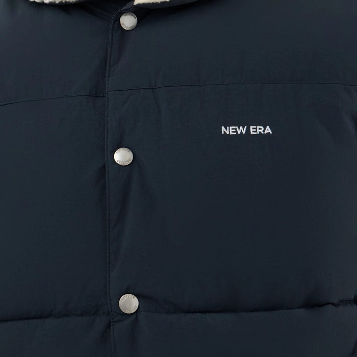 The Male model is wearing  New Era Organic Boa Neck Navy Gilet 6