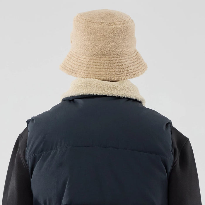 The Male model is wearing  New Era Organic Boa Neck Navy Gilet 8