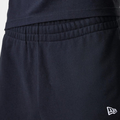 The Male model is wearing New Era Premium Essential Black Joggers 6