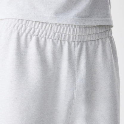 The Male model is wearing New Era Premium Essential Pastel Grey Joggers 6