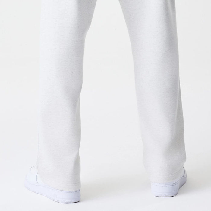 The Male model is wearing New Era Premium Essential Pastel Grey Joggers 7