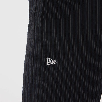 The model is wearing these New Era Street Class straight leg joggers in navy. 3