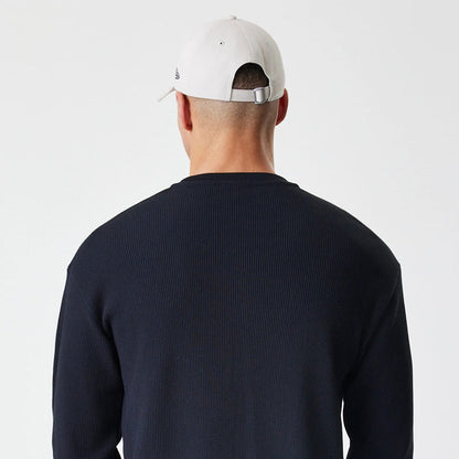 The Male model is wearing  New Era Waffle Black Long Sleeve T-Shirt 7