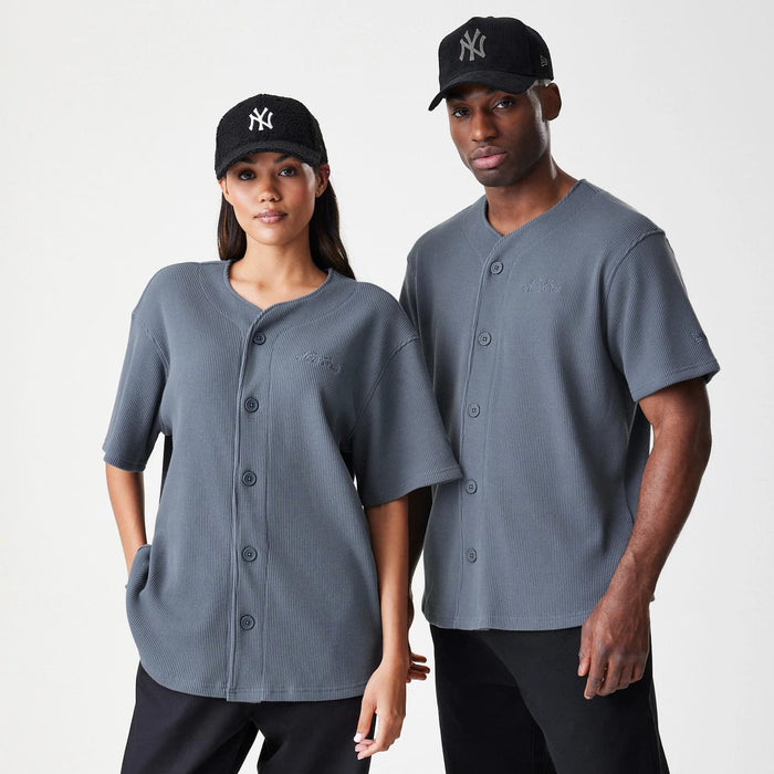 The Male model is wearing  New Era Waffle Dark Grey Jersey 1