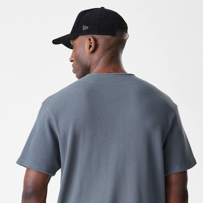 The Male model is wearing  New Era Waffle Dark Grey Jersey 5