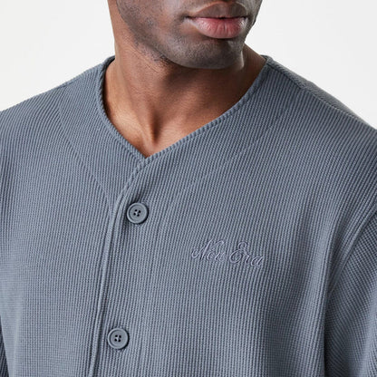 The Male model is wearing  New Era Waffle Dark Grey Jersey 6