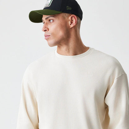 The Male model is wearing  New Era Waffle Light Beige Long Sleeve T-Shirt 4