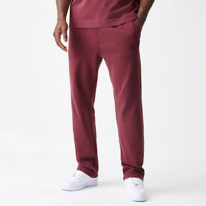 The Male model is wearing  New Era Washed Dark Red Straight Leg Joggers 1