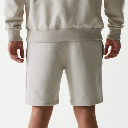 The Male model is wearing New York Yankees MLB League Essential Midi Cream Shorts 7