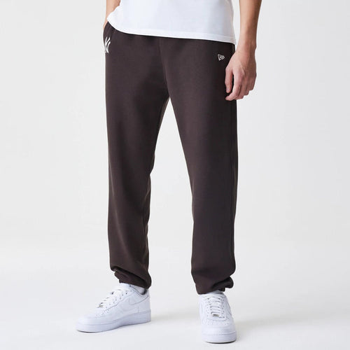 The Male model is wearing New York Yankees MLB Midi League Essential Dark Brown Joggers 1