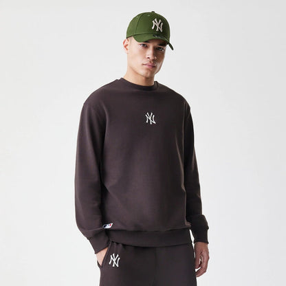 The Male model is wearing New York Yankees MLB Midi League Essential Dark Brown Oversized Crew Neck Sweater 3
