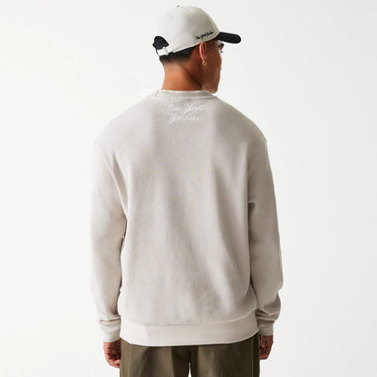 The Male model is wearing New York Yankees MLB Waffle Cream Oversized Crew Neck Sweater 2