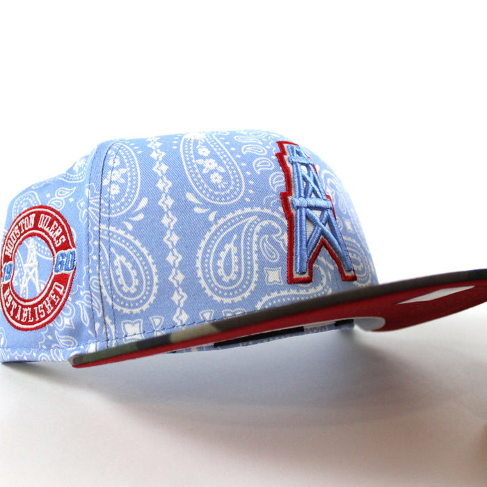 🚨PRE-ORDER🚨 HOUSTON OILERS New Era 59Fifty Fitted Hat (Sky Blue Paisley WoodLand Camo Red Under Brim) 07262023