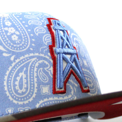 🚨PRE-ORDER🚨 HOUSTON OILERS New Era 59Fifty Fitted Hat (Sky Blue Paisley WoodLand Camo Red Under Brim) 07262023